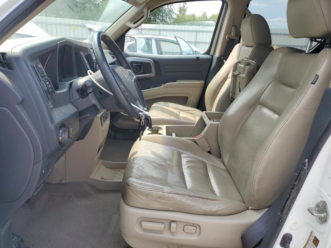 2009 Honda Ridgeline Rtl White vin: 5FPYK16509B105827 Damage: Left Front Seat Cushion, Worn, Replacement Required