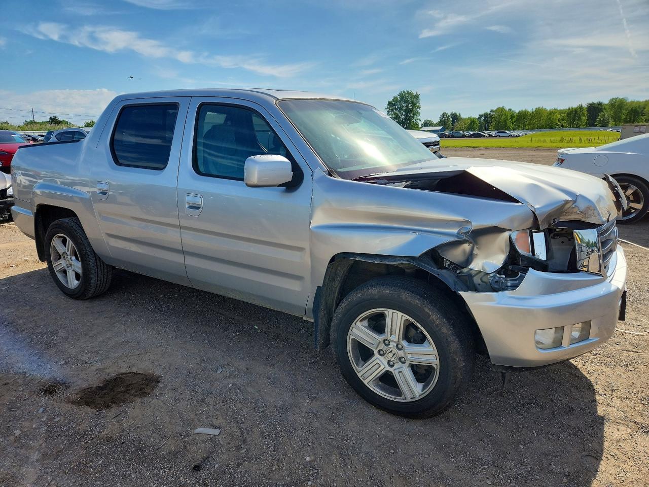 2012 Honda Ridgeline Rtl Silver vin: 5FPYK1F59CB459482