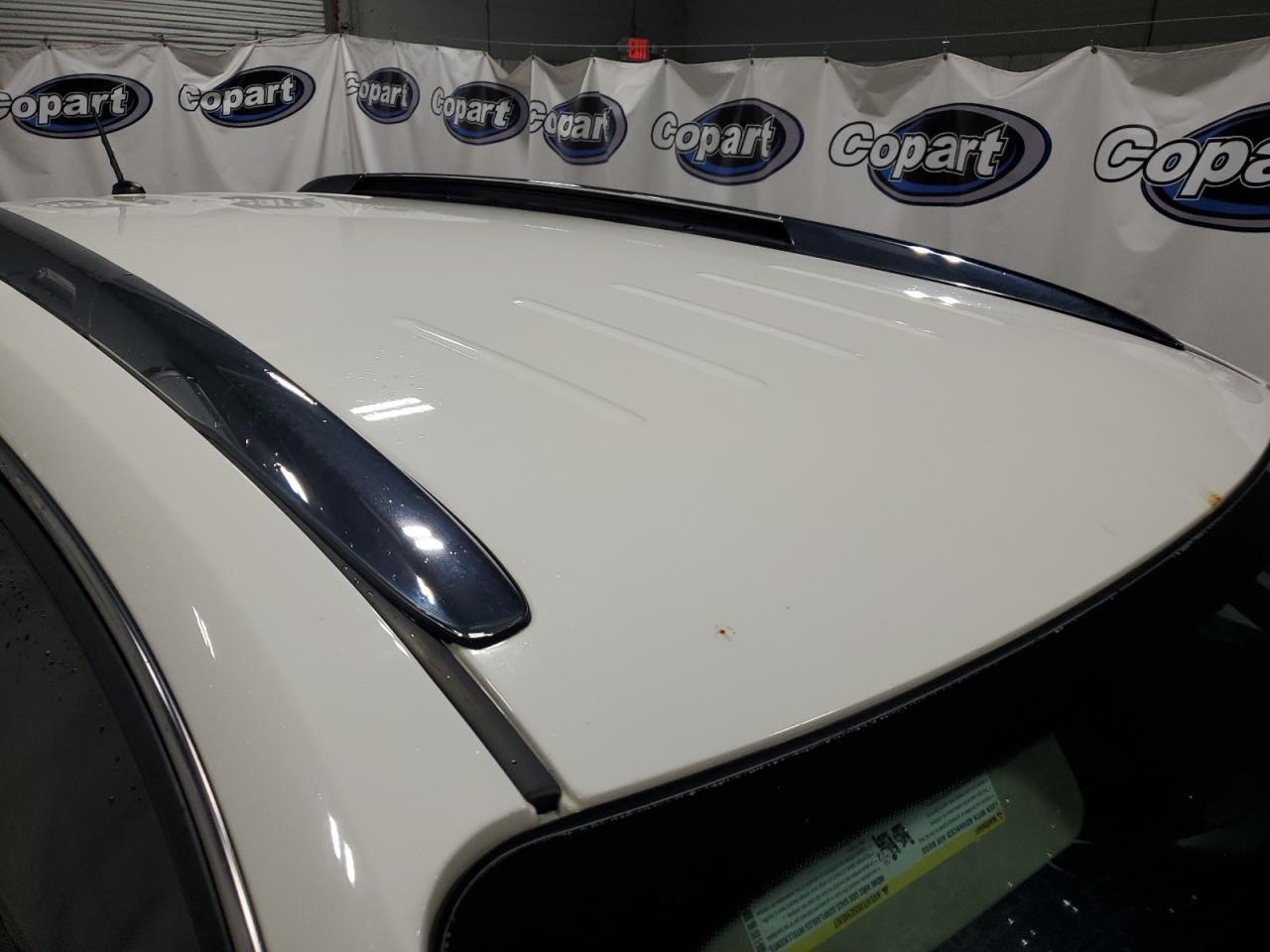 2014 Buick Enclave White vin: 5GAKVCKD5EJ268850 Damage: Roof Panel, Rust, 1/2 To 1 Inch