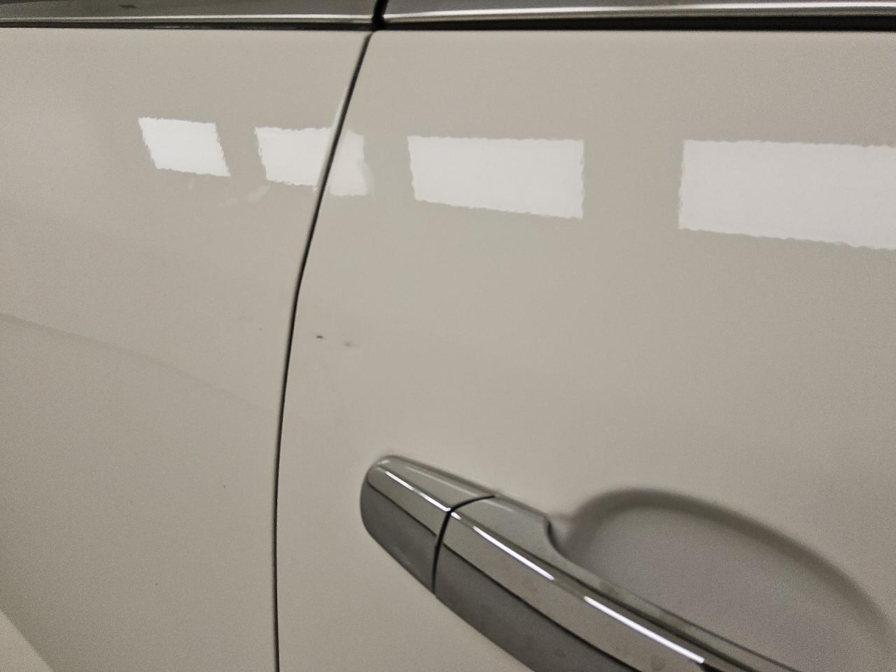 2012 Buick Enclave White vin: 5GAKVDED0CJ354520 Damage: Right Front Door, Dent(S) W/No Paint Dmg, 1/8 To 1/2 Inch