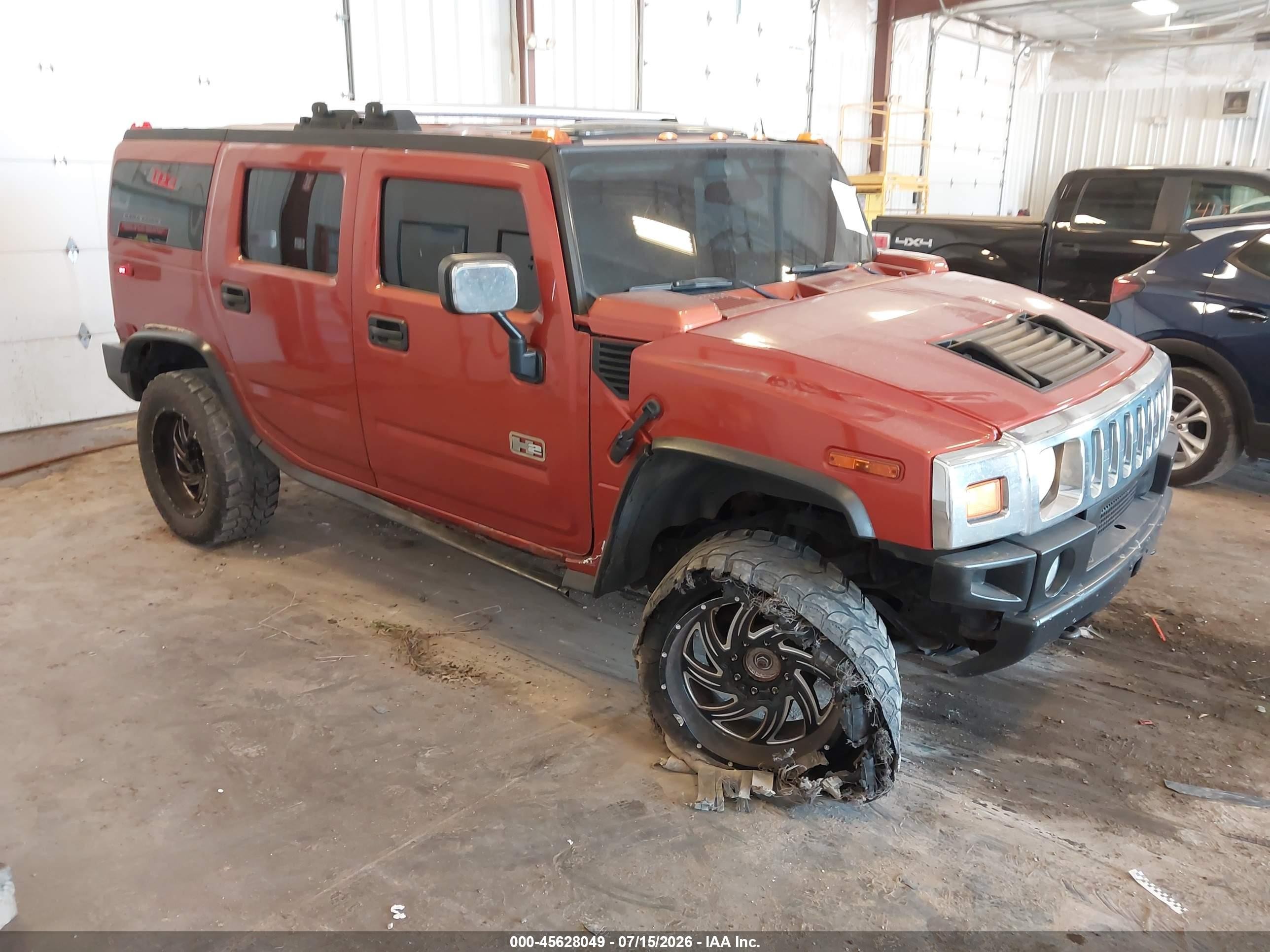 2003 Hummer H2   Orange vin: 5GRGN23UX3H147733