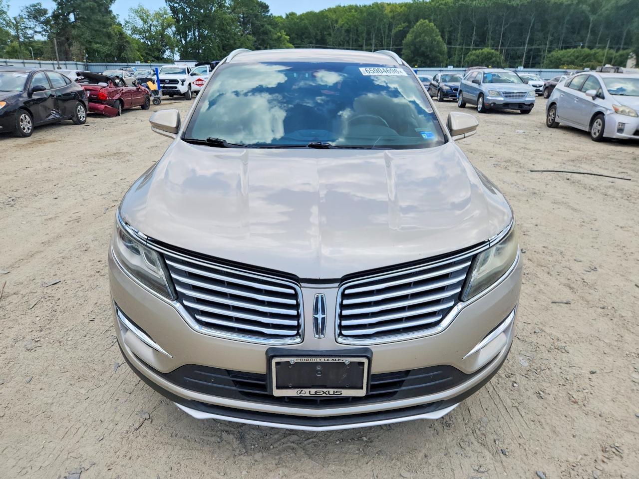 2015 Lincoln Mkc Gold vin: 5LMCJ2A9XFUJ04377