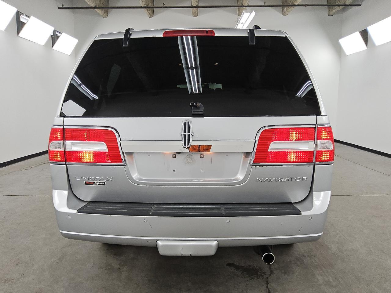 2013 Lincoln Navigator Silver vin: 5LMJJ2J53DEL06036 Damage: Rear Bumper Center Molding, Gouged, 1 To 2 Inches