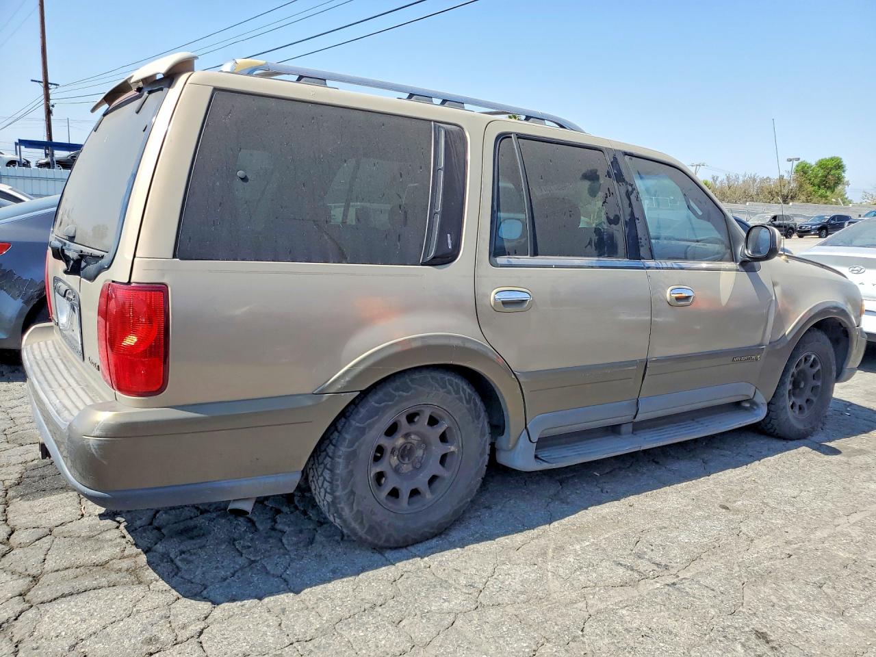 1999 Lincoln Navigator Tan vin: 5LMRU27A2XLJ39098