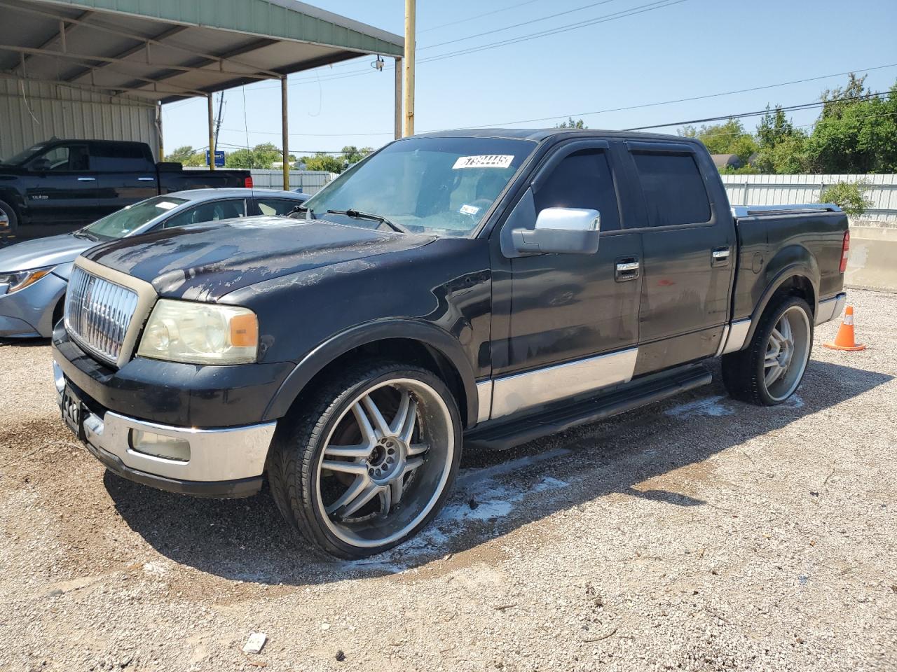 2006 Lincoln Mark Lt Black vin: 5LTPW16566FJ04145 Damage: Left Front Fender, Dent(s) W/No Paint Dmg, 1/8 to 1/2 inch