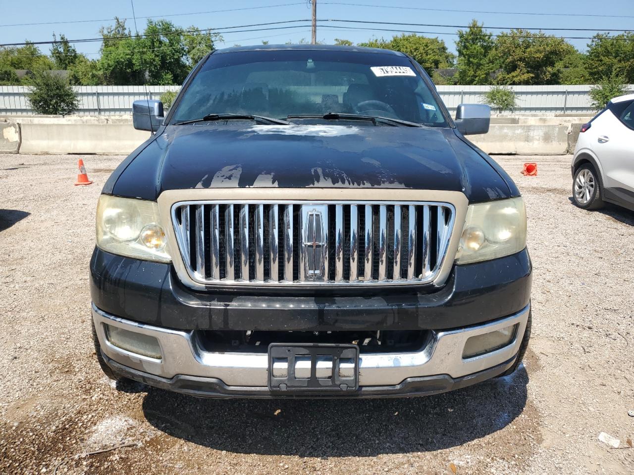 2006 Lincoln Mark Lt Black vin: 5LTPW16566FJ04145 Damage: Left Head Lamp, Faded, Repair Required