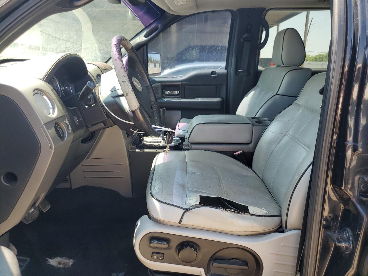 2006 Lincoln Mark Lt Black vin: 5LTPW16566FJ04145 Damage: Left Front Seat, Torn, 1 to 2 inches