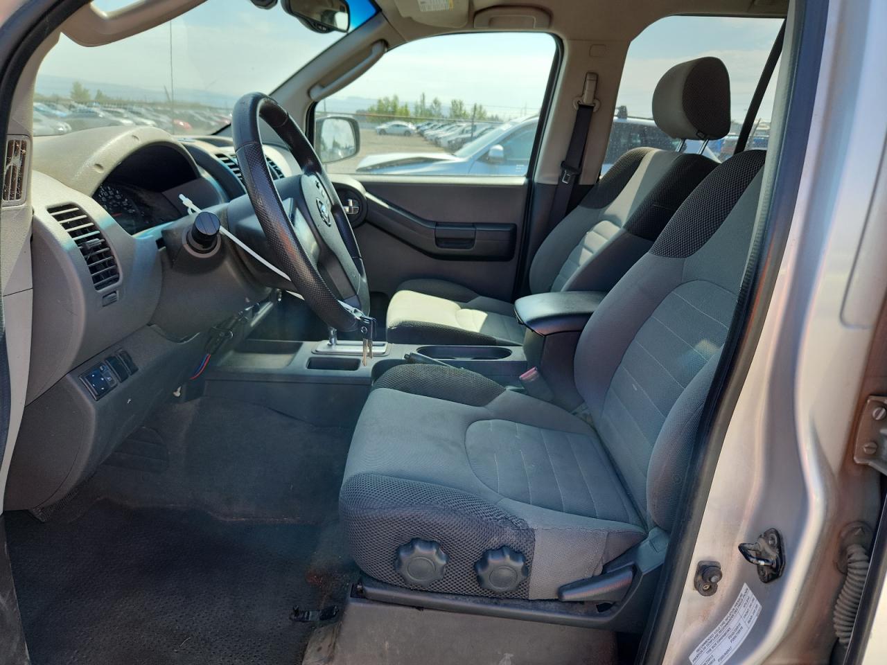 2005 Nissan Xterra S Silver vin: 5N1AN08W65C649270 Damage: Left Front Seat, Torn, 1/2 To 1 Inch
