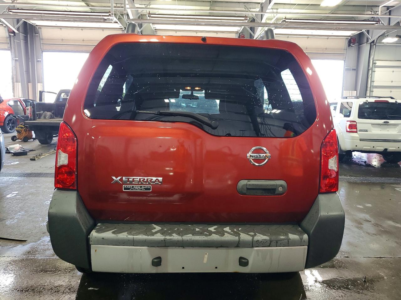 2012 Nissan Xterra X Orange vin: 5N1AN0NU5CC502888