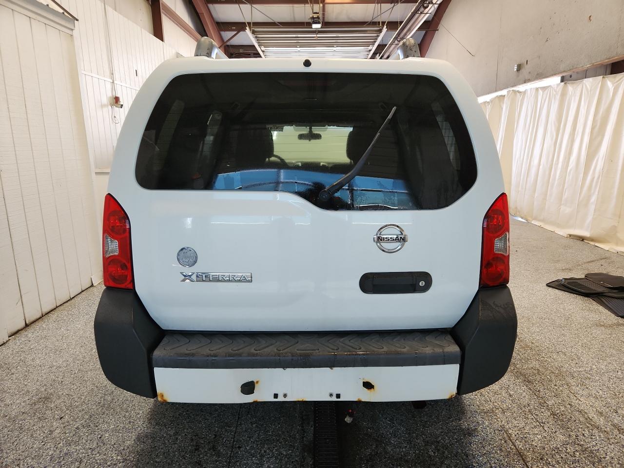 2012 Nissan Xterra X White vin: 5N1AN0NW9CC501924 Damage: Rear Metal Bumper Painted, Rust, > 12 Inches