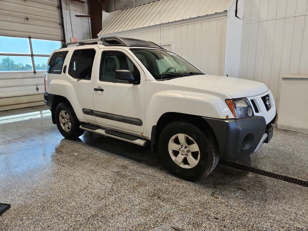 2012 Nissan Xterra X White vin: 5N1AN0NW9CC501924 Damage: Right Rocker Panel, Rust, 2 To 3 Inches