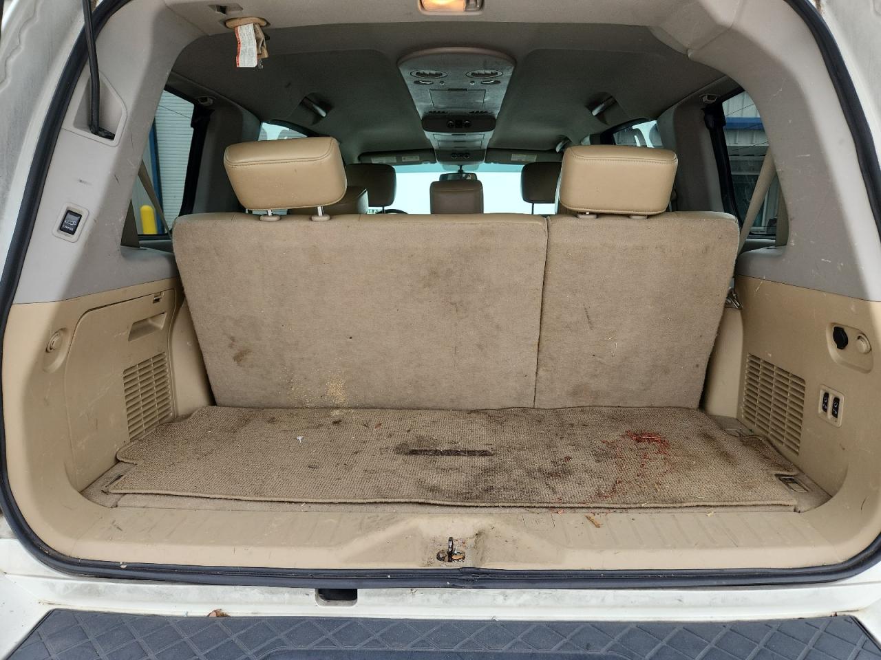 2015 Nissan Armada Sl White vin: 5N1BA0ND5FN617600 Damage: Trunk/Cargo Mat, Stained, Permanent