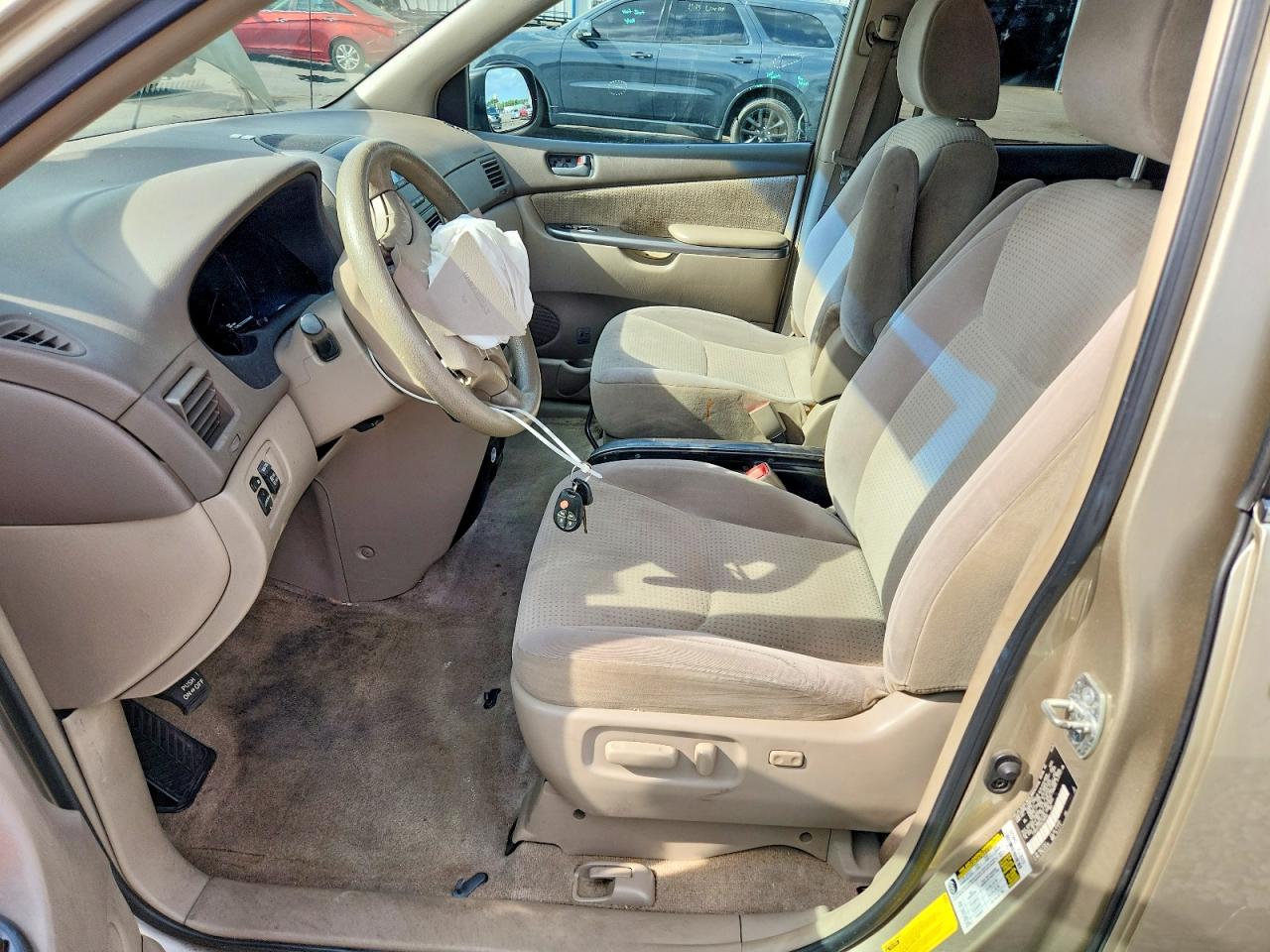 2010 Toyota Sienna Le 7-passenger Tan vin: 5TDKK4CC0AS289086