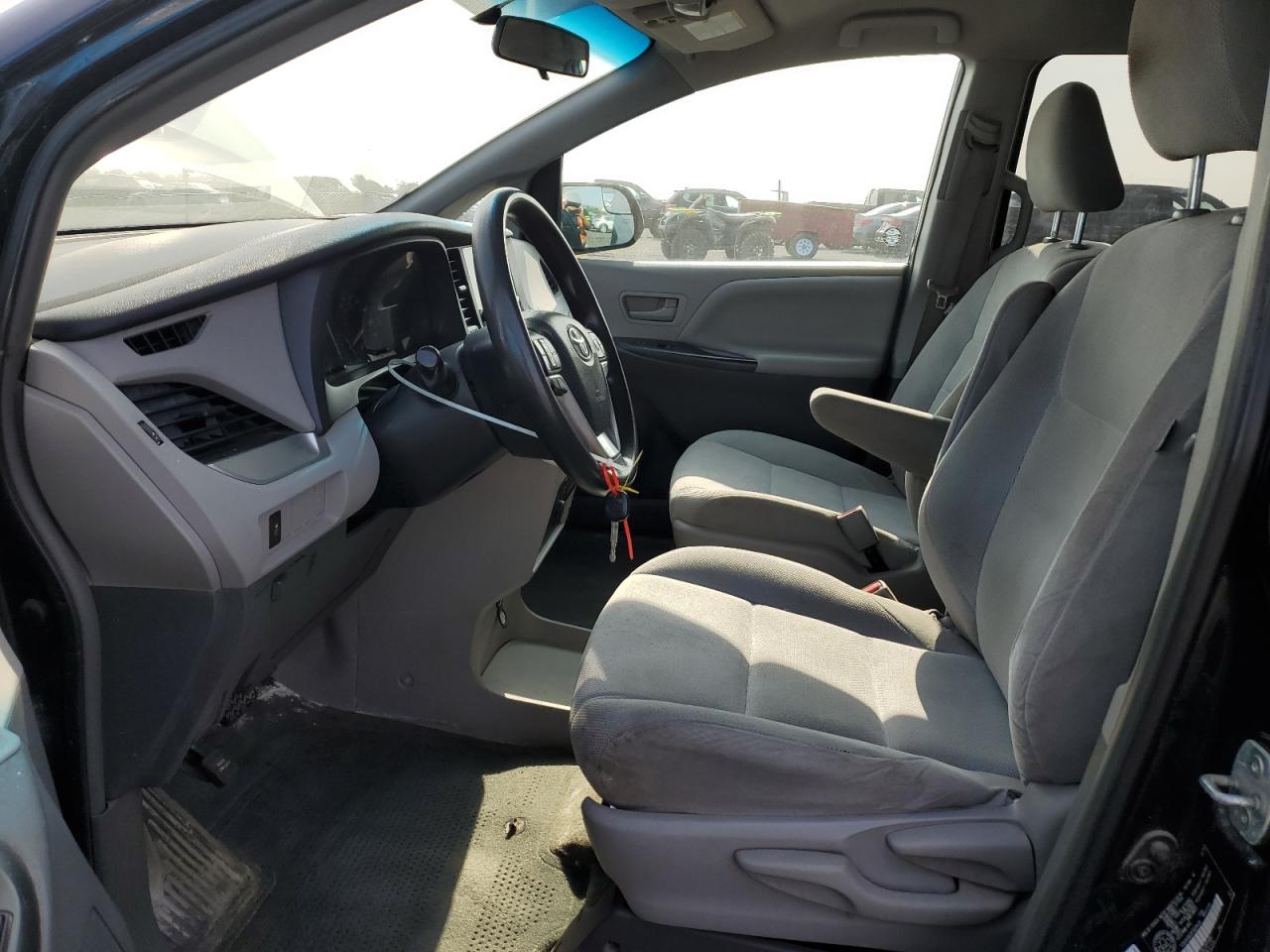 2015 Toyota Sienna L 7-passenger Black vin: 5TDZK3DC3FS629426 Damage: Left Front Seat Molding, Loose, Repair Required