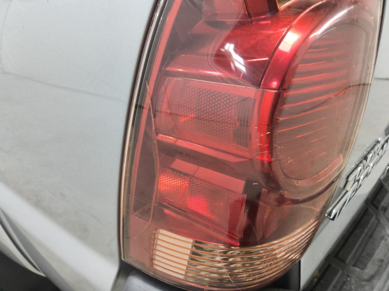 2006 Toyota Tacoma Double Cab Prerunner Silver vin: 5TEJU62N76Z183409 Damage: Left Tail Light, Broken, Replacement Required