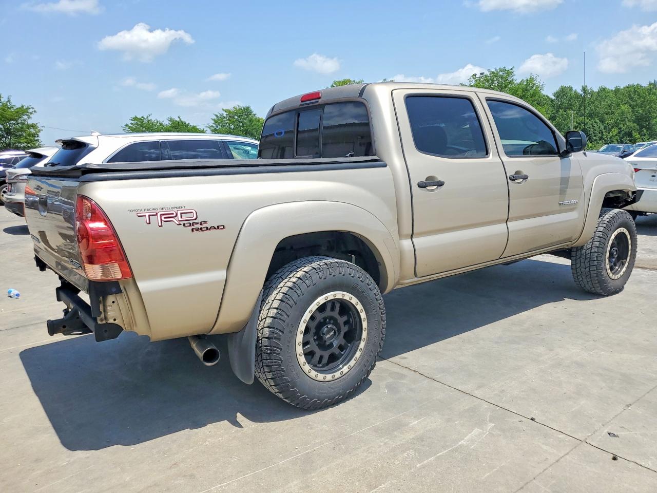 2005 Toyota Tacoma Double Cab Золотой vin: 5TELU42N45Z047217