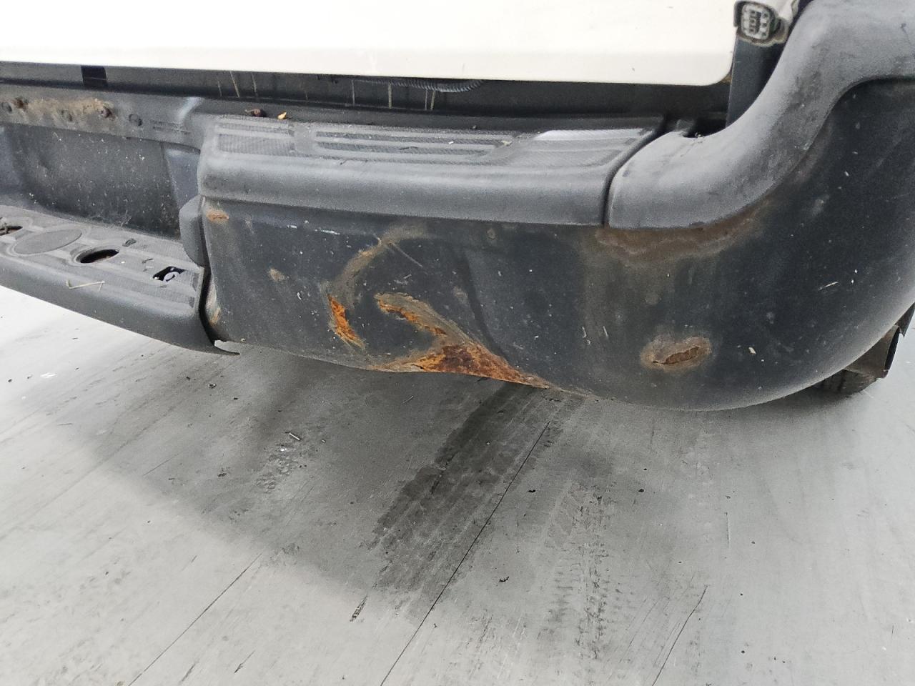 2013 Toyota Tacoma Base White vin: 5TFNX4CN0DX022027 Damage: Rear Metal Bumper Painted, Dent(S) W/ Paint Dmg, > 12 Inches