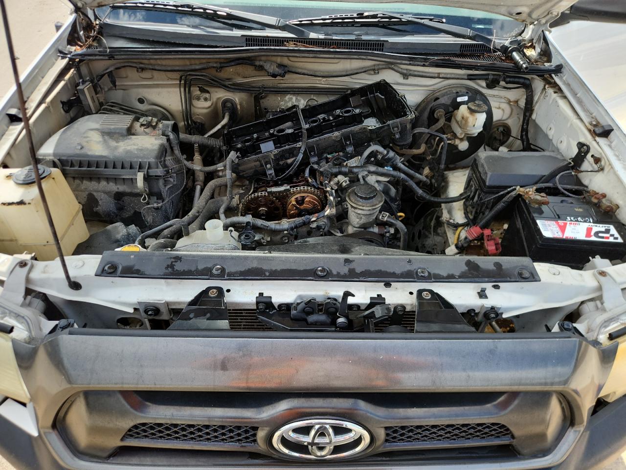 2014 Toyota Tacoma Base White vin: 5TFNX4CN6EX035608 Damage: Upper Engine, Missing, Replacement Required