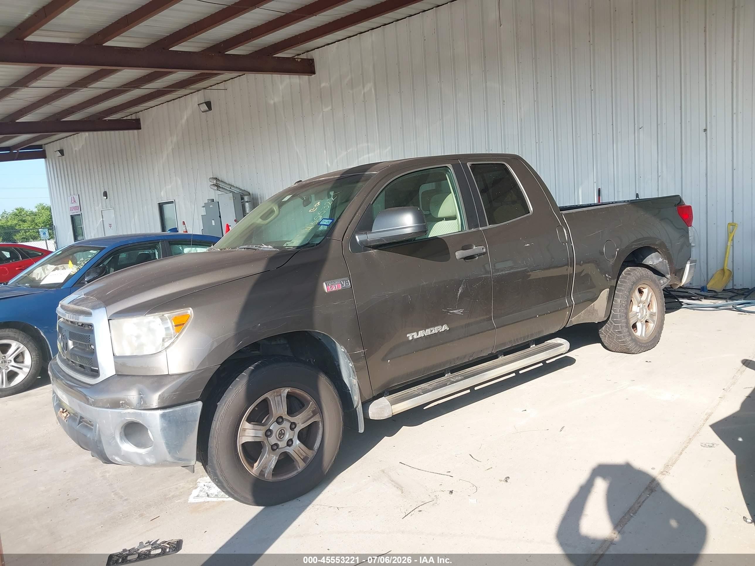 2010 Toyota Tundra Grade 5.7l V8 Tan vin: 5TFRY5F12AX075420