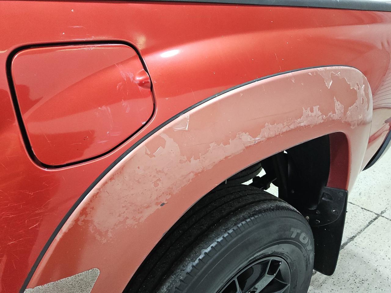 2013 Toyota Tacoma Prerunner Access Cab Red vin: 5TFTX4GN5DX021957 Damage: Left Rear Wheel Opening Mldg, Peeling, > 12 Inches