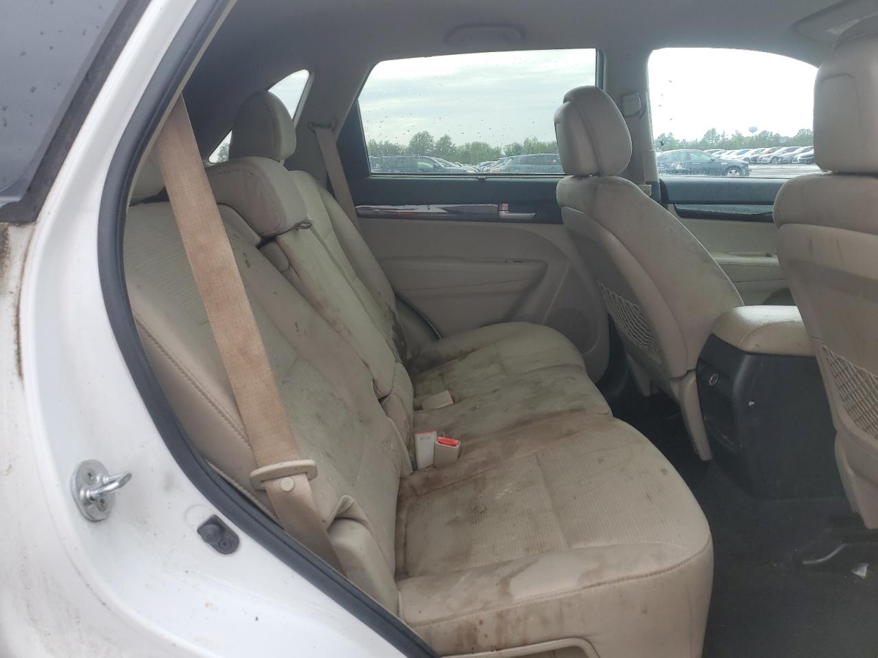2015 Kia Sorento Lx White vin: 5XYKTCA65FG607809 Damage: Left Rear Seat Cushion, Stained, Permanent