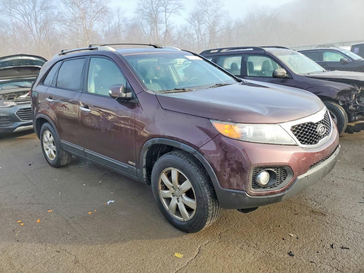2012 Kia Sorento Base Maroon vin: 5XYKTDA61CG299104