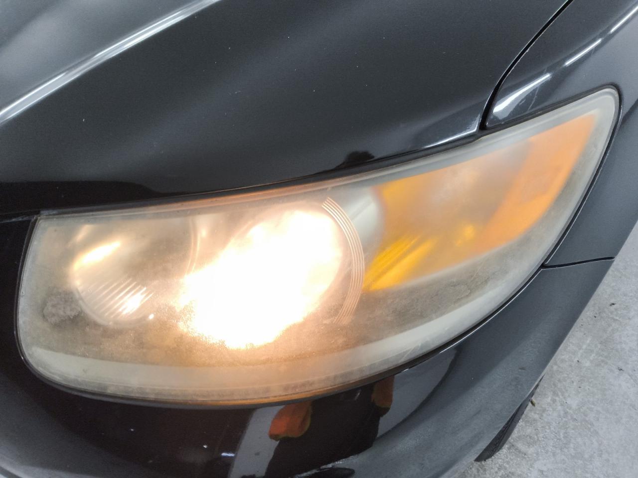 2012 Hyundai Santa Fe Se Black vin: 5XYZHDAGXCG098374 Damage: Left Head Lamp, Faded, Repair Required