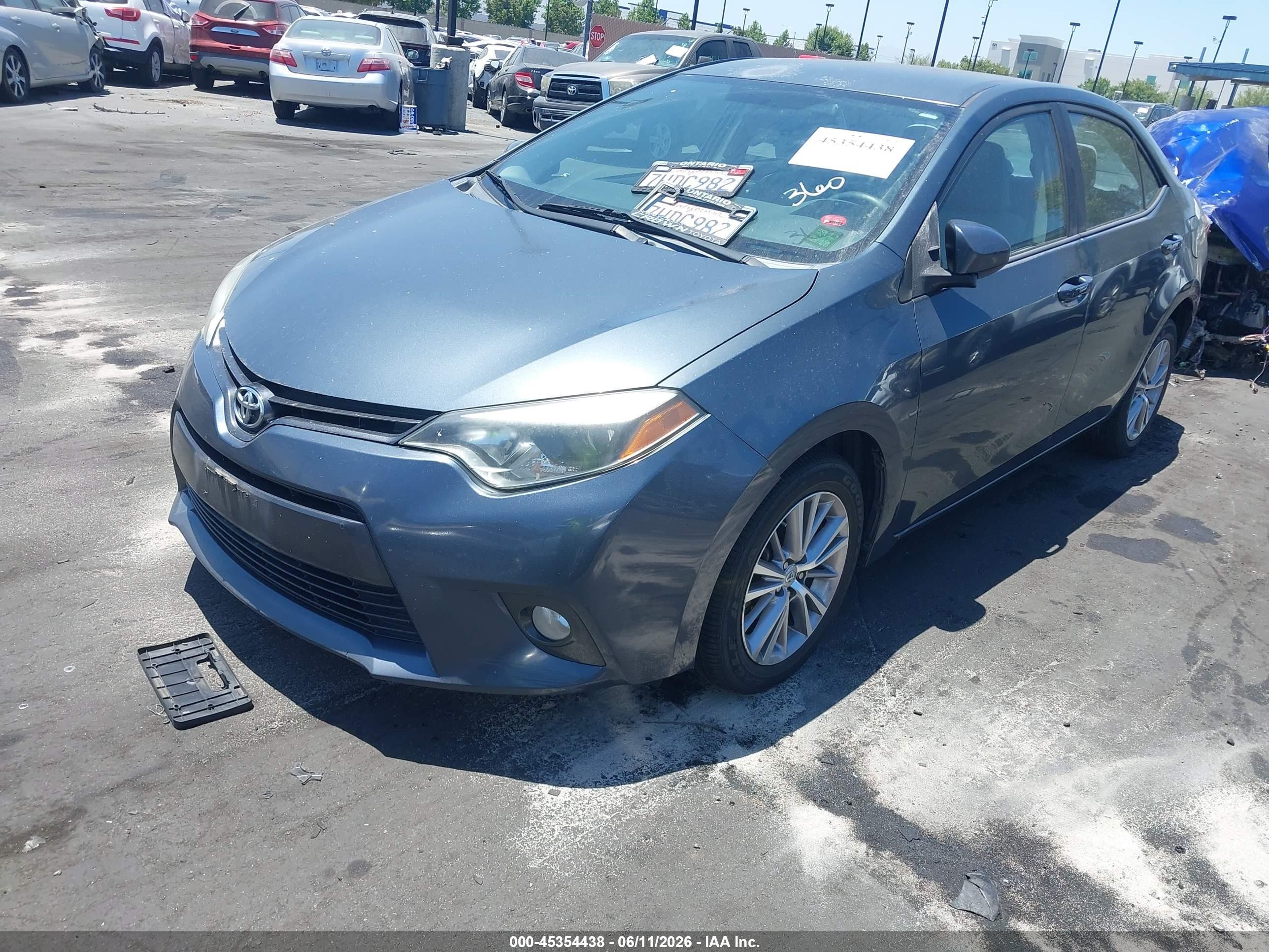 2015 Toyota Corolla Le Plus Blue vin: 5YFBURHE0FP203860