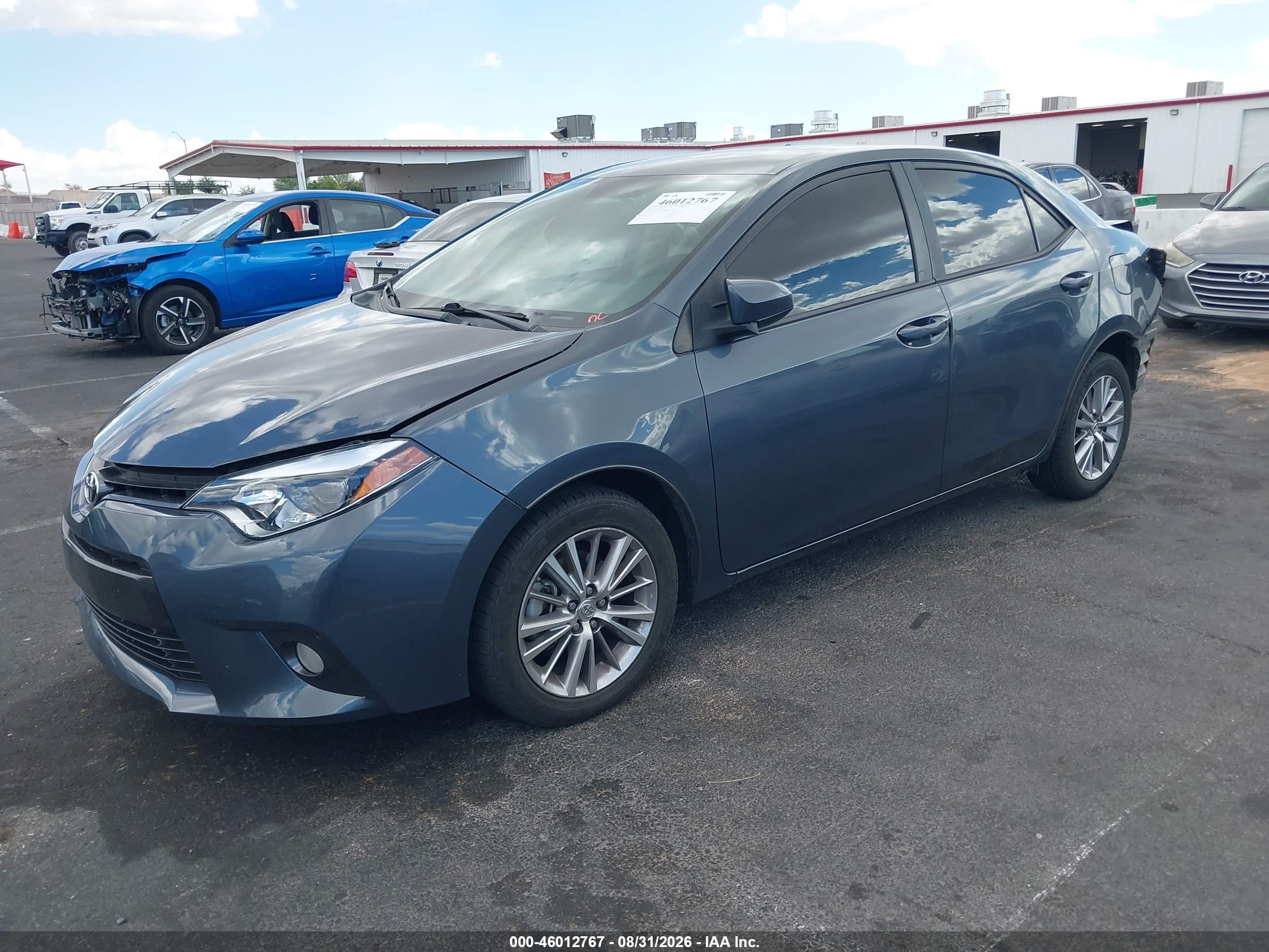 2015 Toyota Corolla Le Plus Blue vin: 5YFBURHE7FP275543