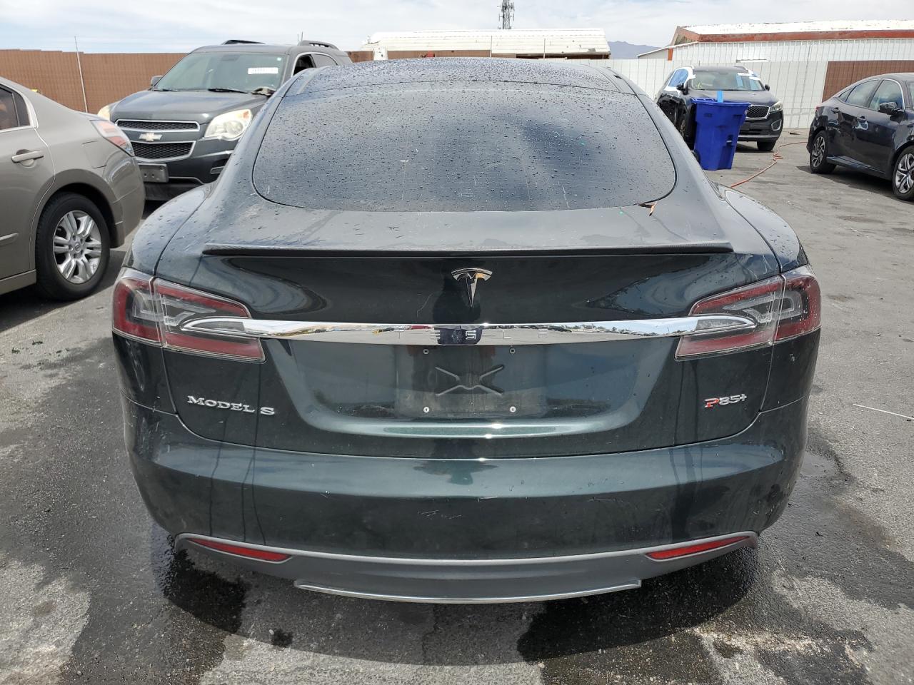 2013 Tesla Model S Green vin: 5YJSA1CP9DFP19579 Damage: Deck Lid, Dent(S) W/ Paint Dmg, 1 To 2 Inches