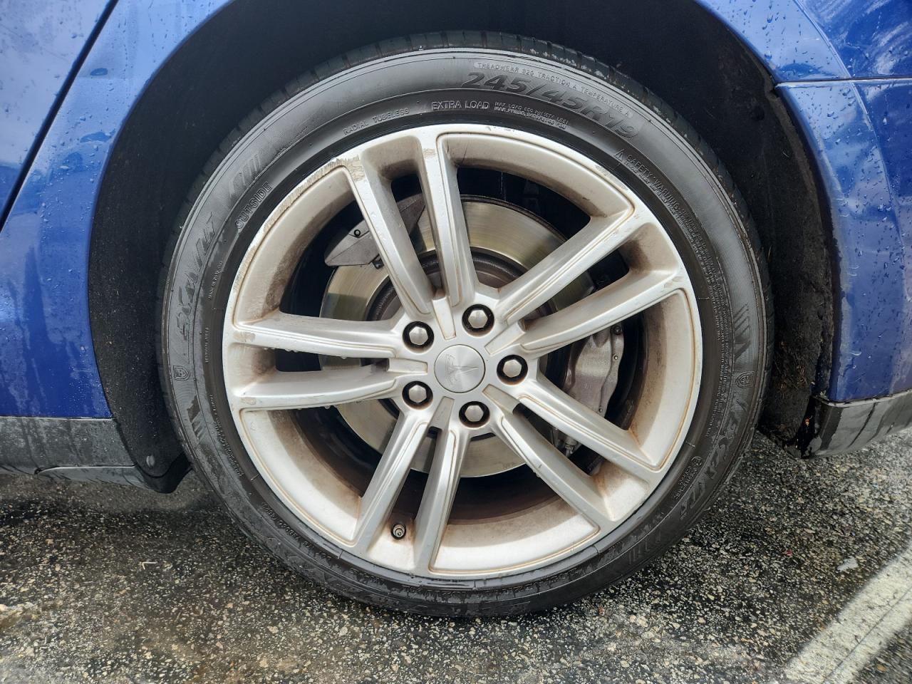 2015 Tesla Model S Blue vin: 5YJSA1E20FF114287 Damage: Left Rocker Panel, Dent(S) W/ Paint Dmg, 1 To 2 Inches