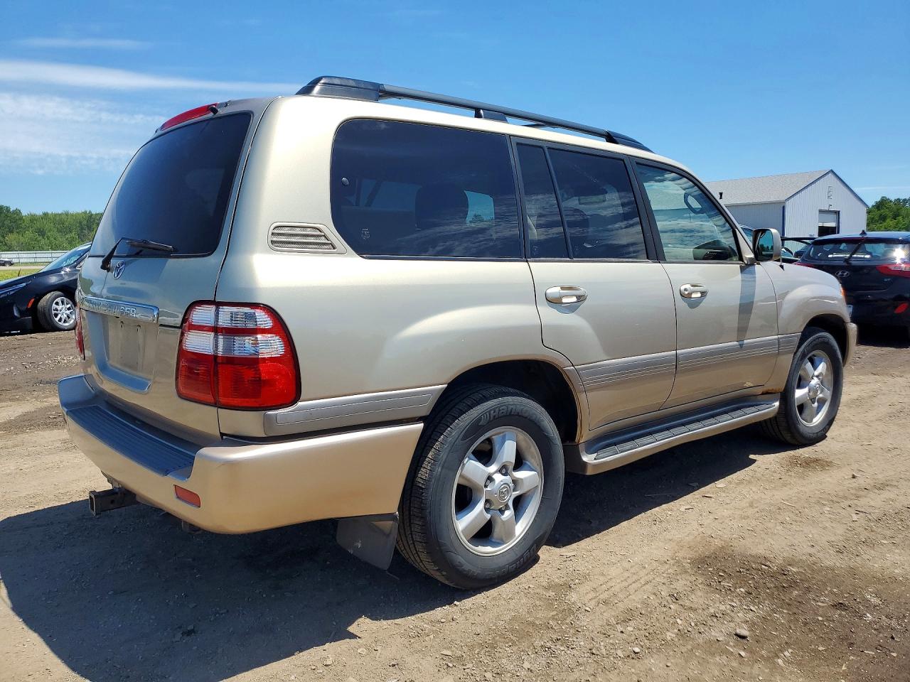 2005 Toyota Land Cruiser Base Gold vin: JTEHT05J152070853