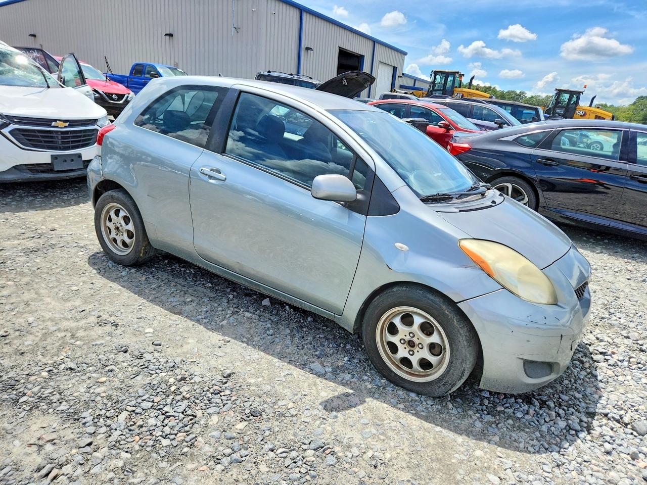 2009 Toyota Yaris Base Серебряный vin: JTDJT903X95263929