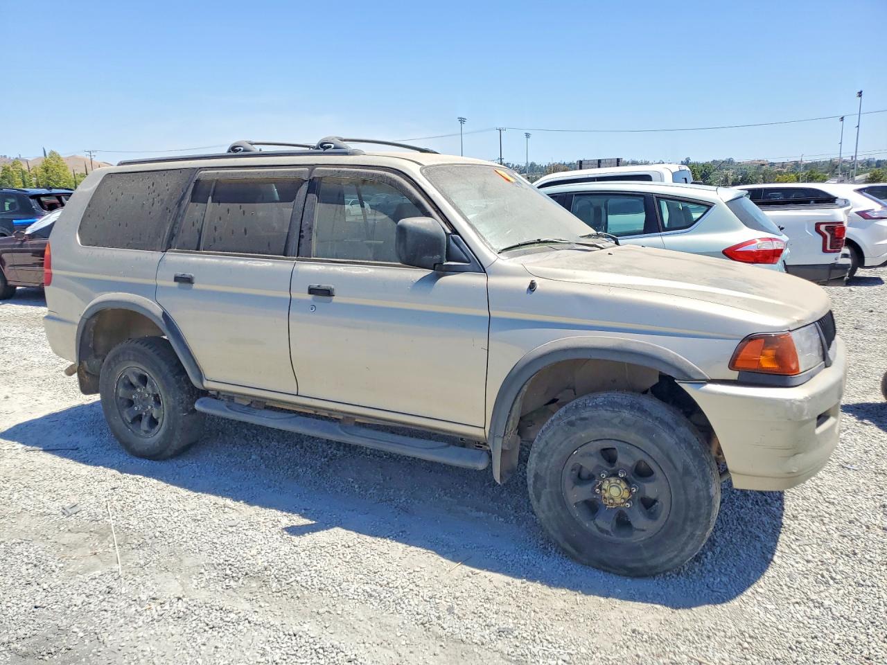 1999 Mitsubishi Montero Sport Ls Tan vin: JA4LS31H3XP043207