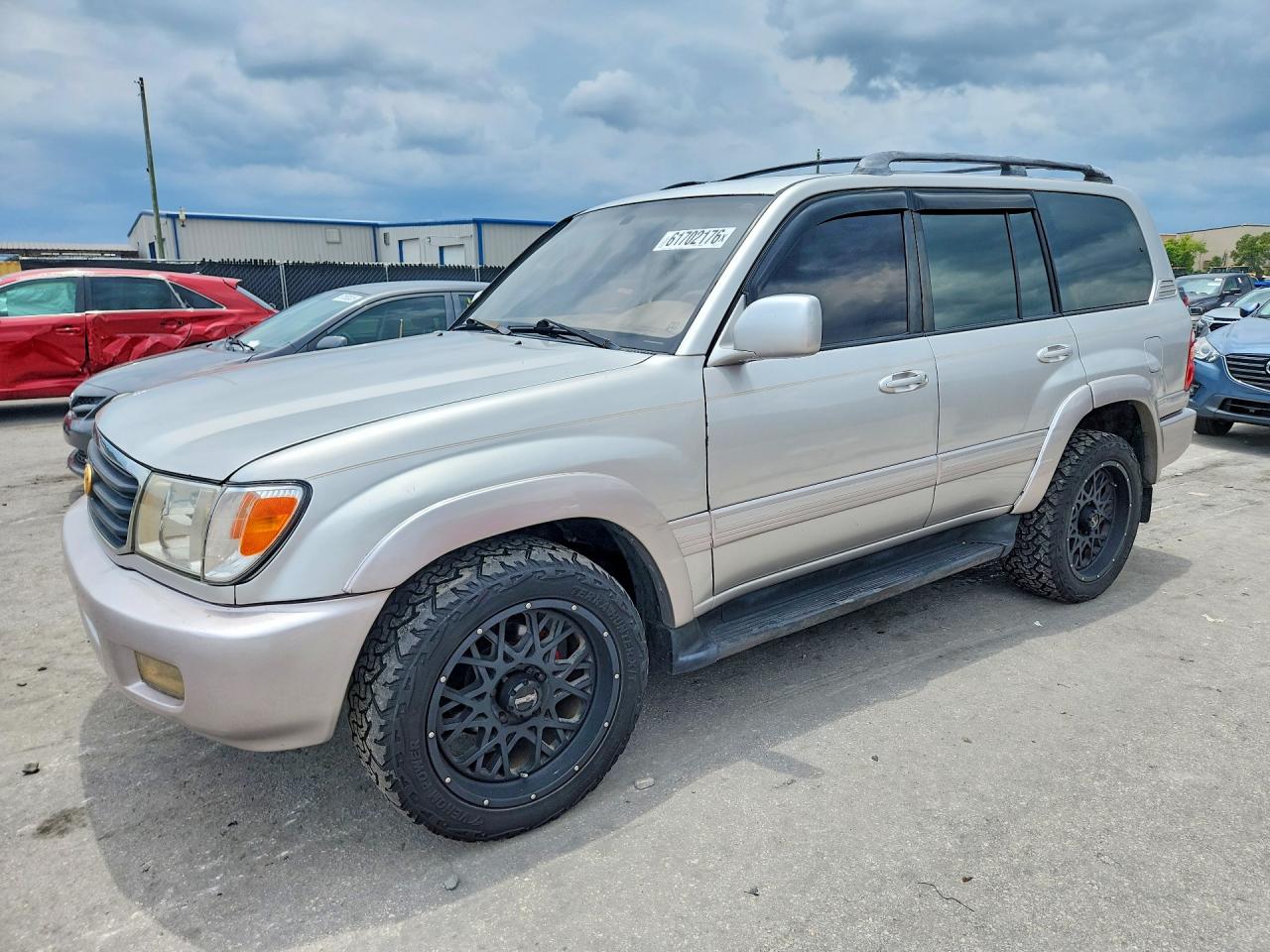 1999 Toyota Land Cruiser Base Gold vin: JT3HT05J5X0027141