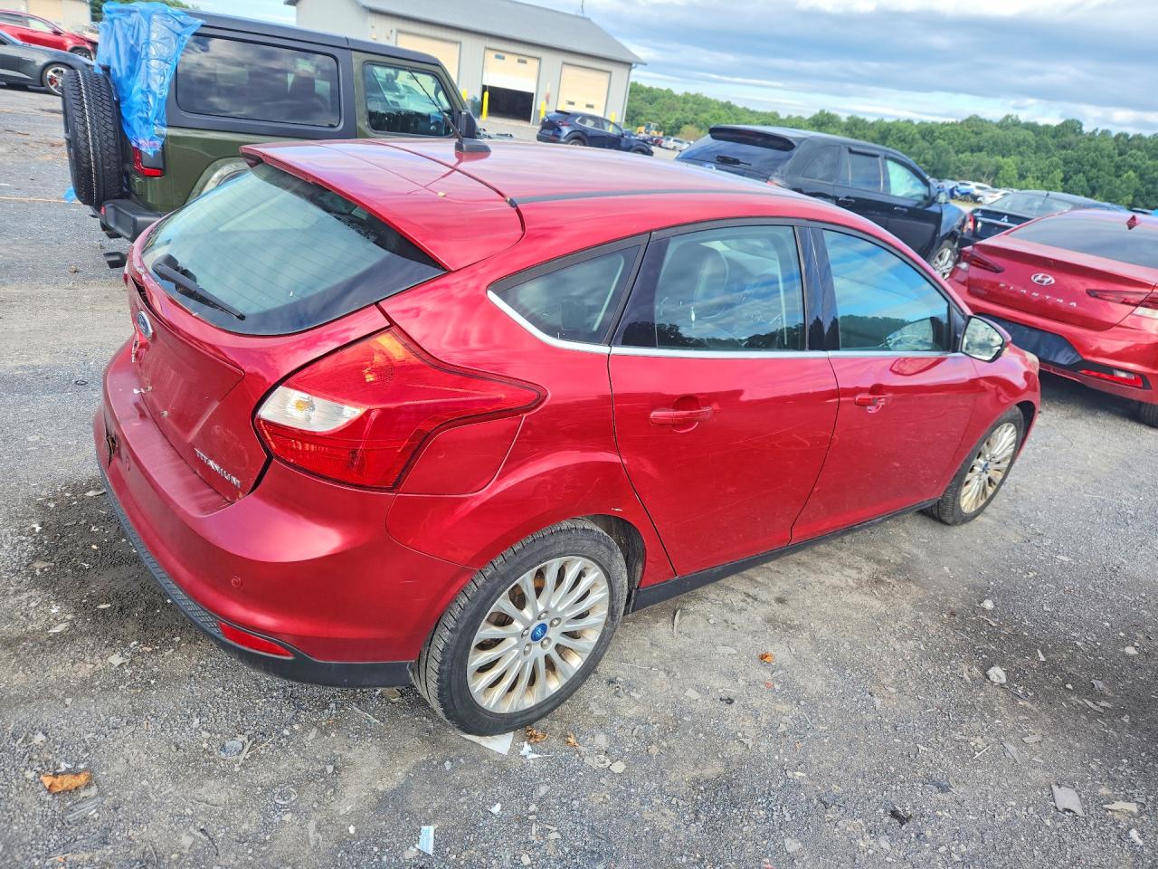 2012 Ford Focus Titanium Red vin: 1FAHP3N29CL308982