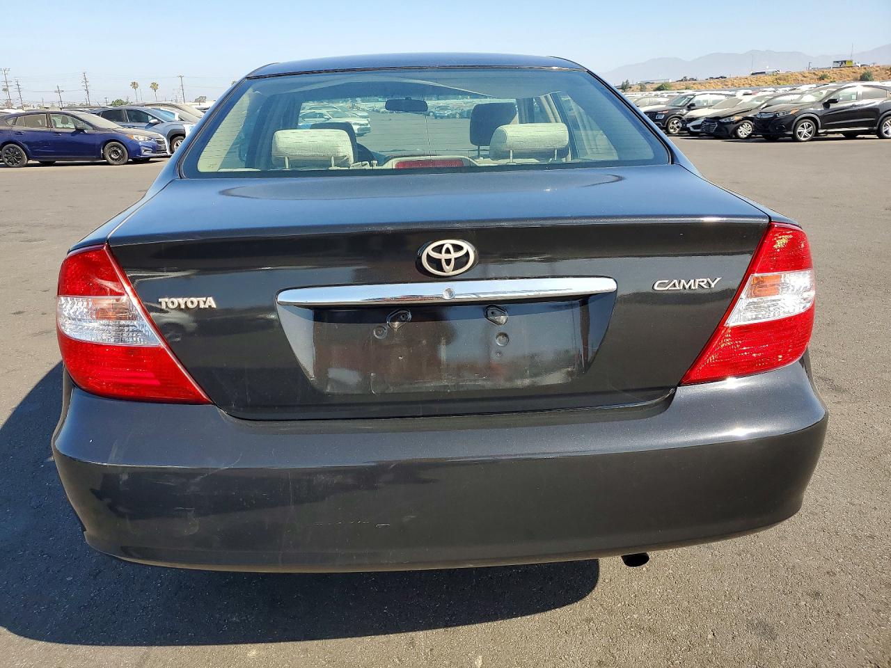2004 Toyota Camry Le Black vin: JTDBE30K140279025