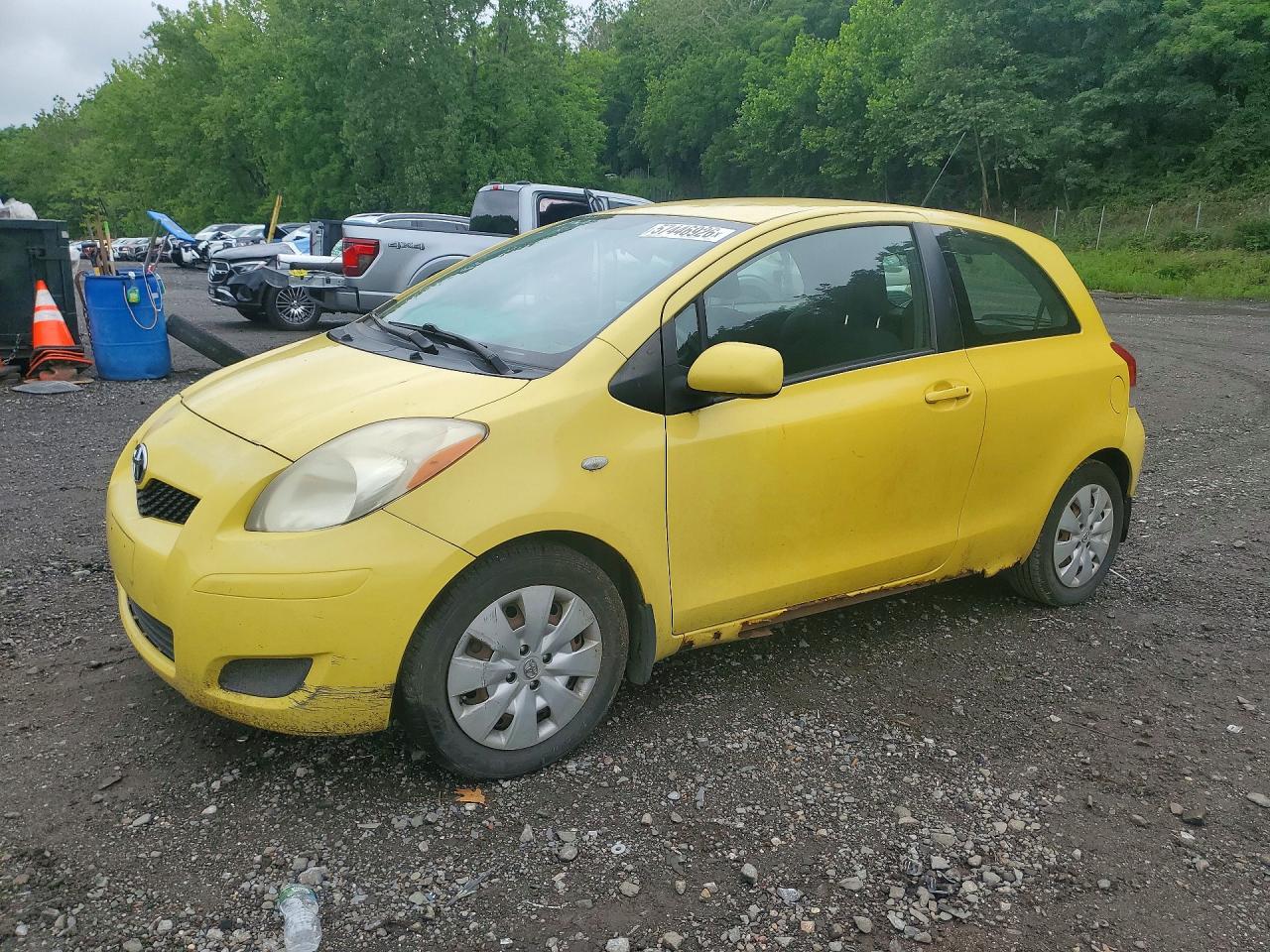 2009 Toyota Yaris Base Желтый vin: JTDJT903X95250243