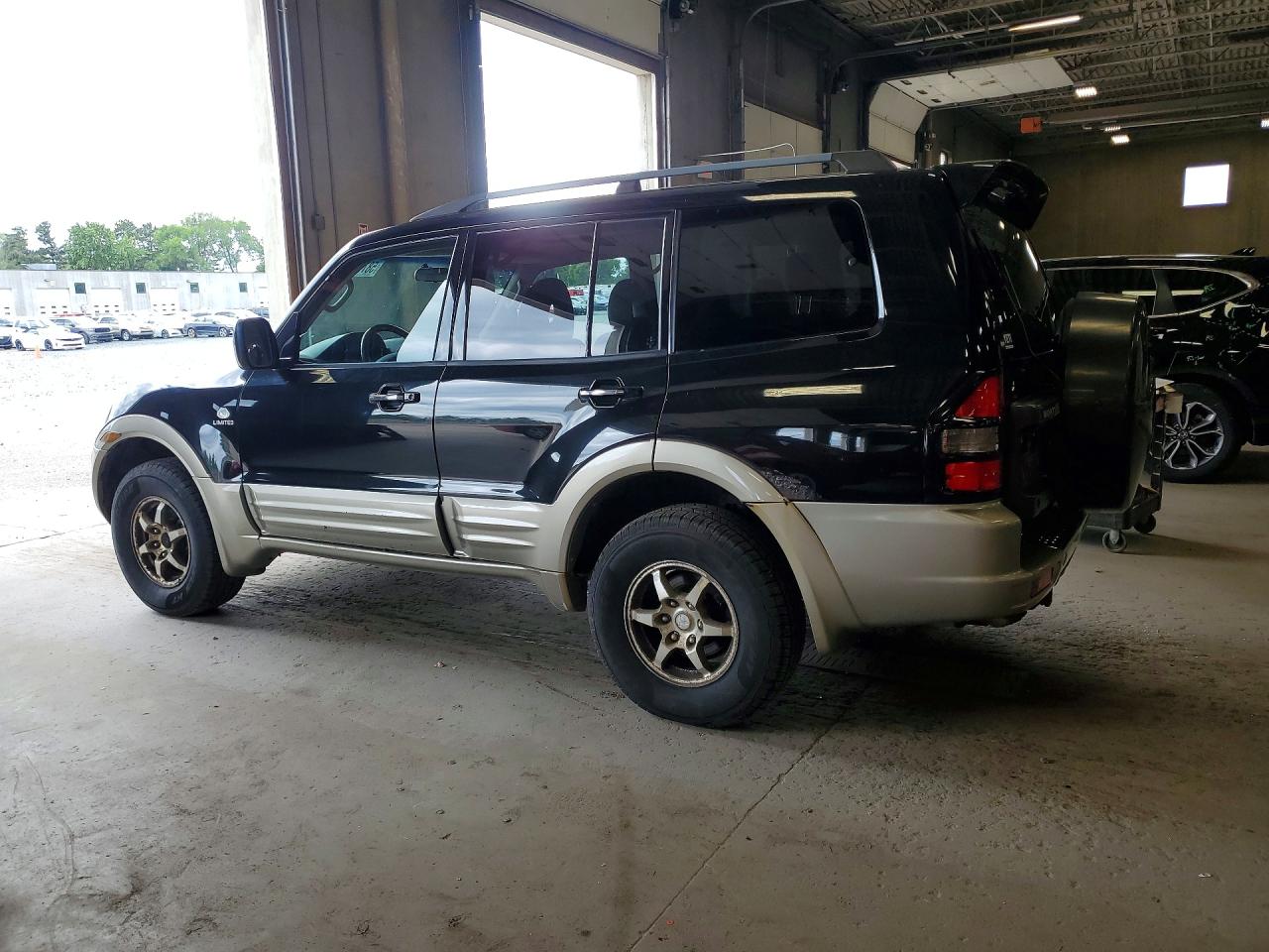 2002 Mitsubishi Montero Limited Black vin: JA4MW51RX2J003019