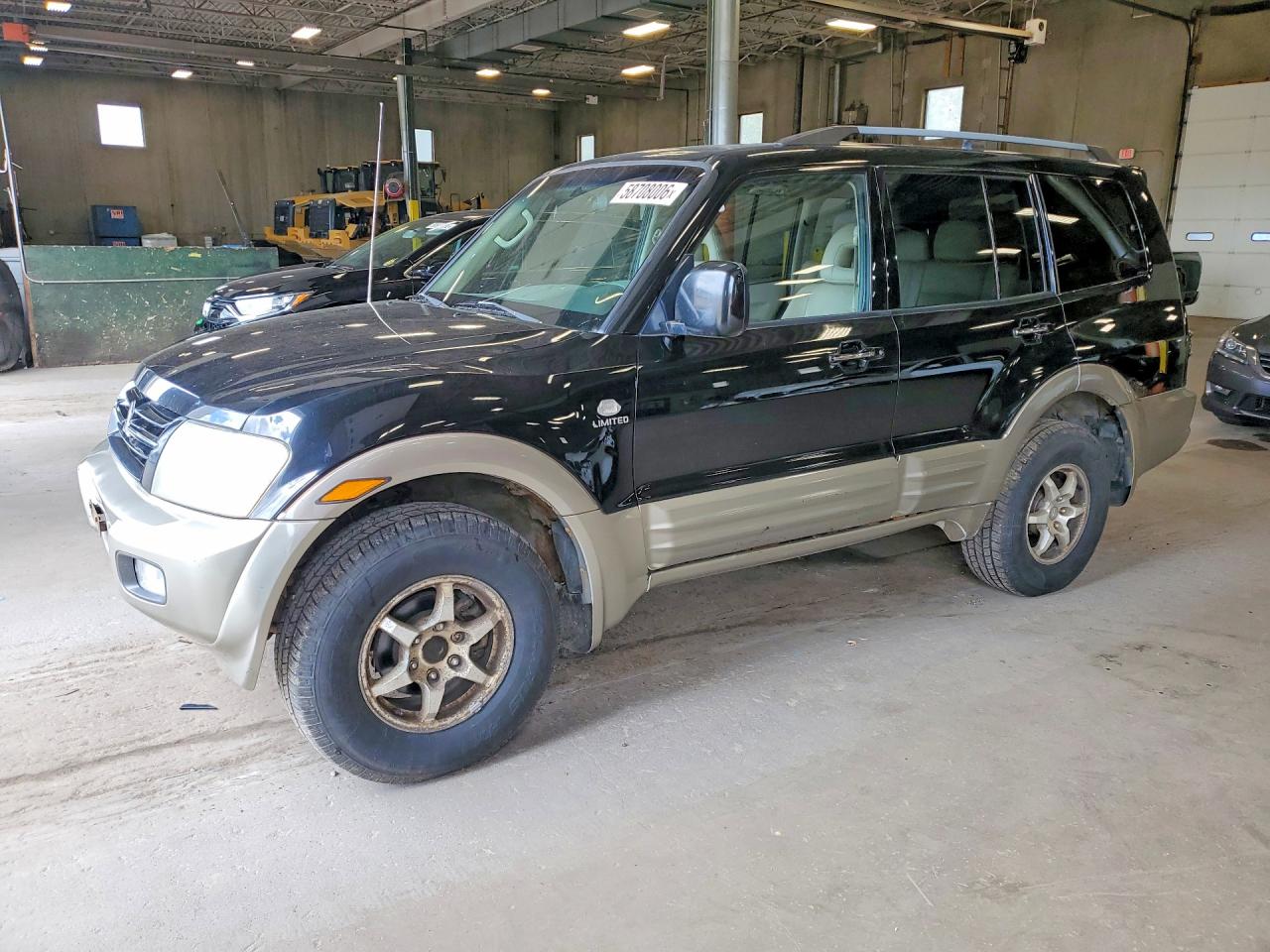 2002 Mitsubishi Montero Limited Black vin: JA4MW51RX2J003019