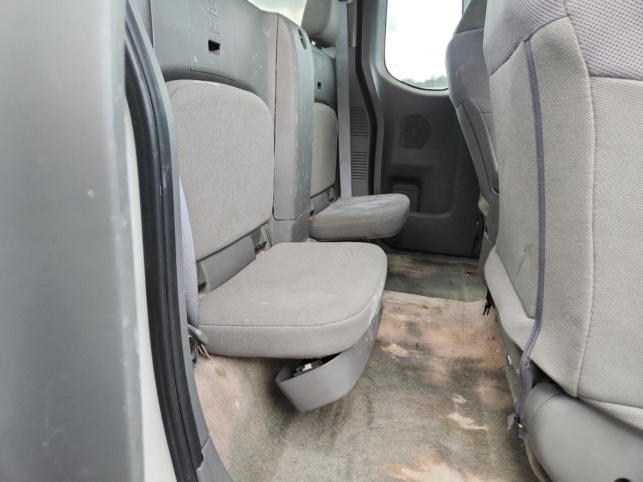 2015 Nissan Frontier S White vin: 1N6BD0CT8FN735479 Damage: Left Rear Carpet, Stained, Permanent