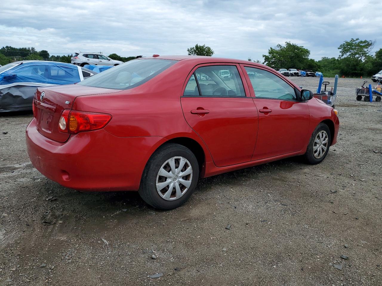 2009 Toyota Corolla Le Red vin: 2T1BU40E19C105715