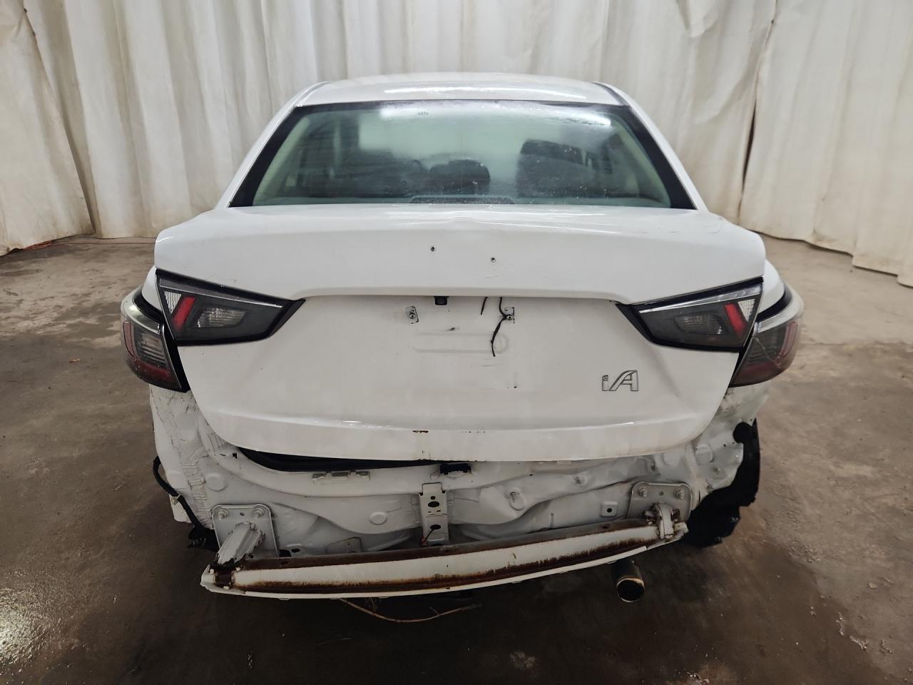 2018 Toyota Yaris Ia Base White vin: 3MYDLBYVXJY311299 Damage: Deck Lid, Dent(S) W/ Paint Dmg, 5 To 6 Inches