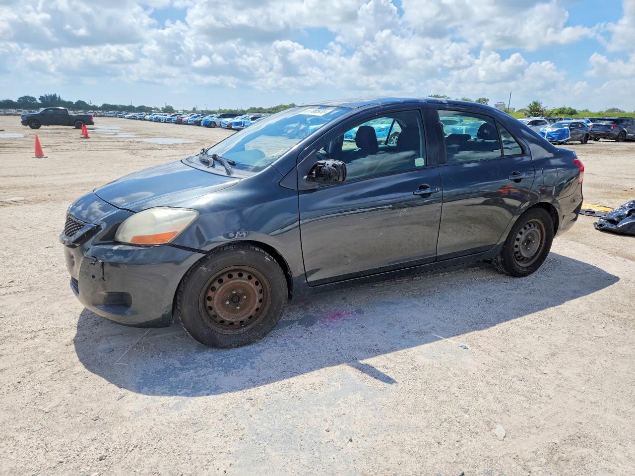2011 Toyota Yaris Base Black vin: JTDBT4K34BL002107