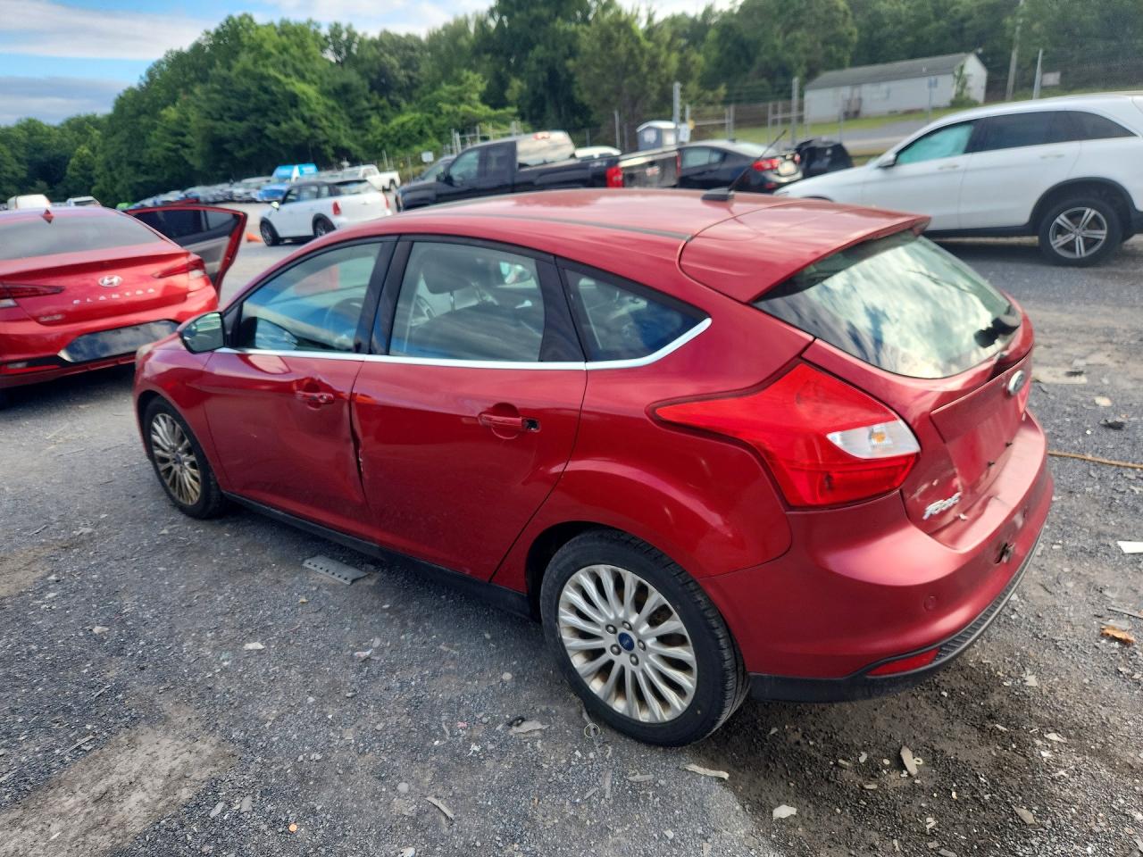 2012 Ford Focus Titanium Red vin: 1FAHP3N29CL308982
