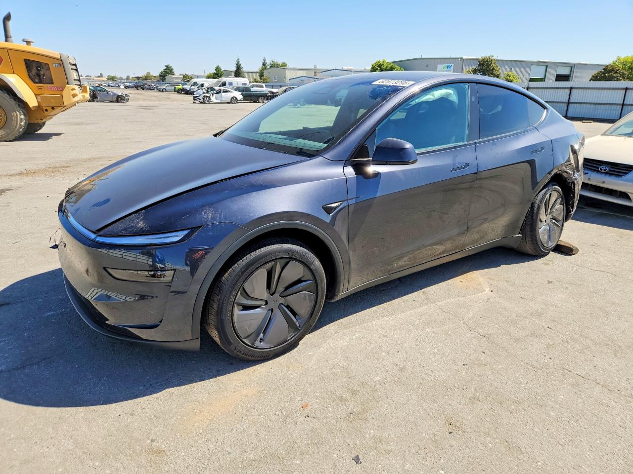 2026 Tesla Model Y Black vin: 7SAYGDED1TF660140