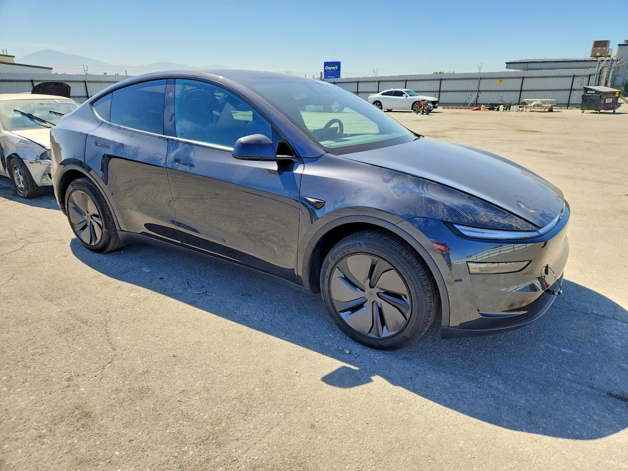 2026 Tesla Model Y Black vin: 7SAYGDED1TF660140