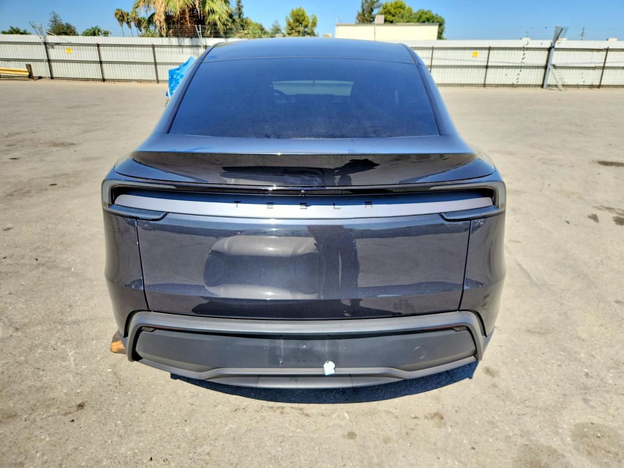 2026 Tesla Model Y Black vin: 7SAYGDED1TF660140