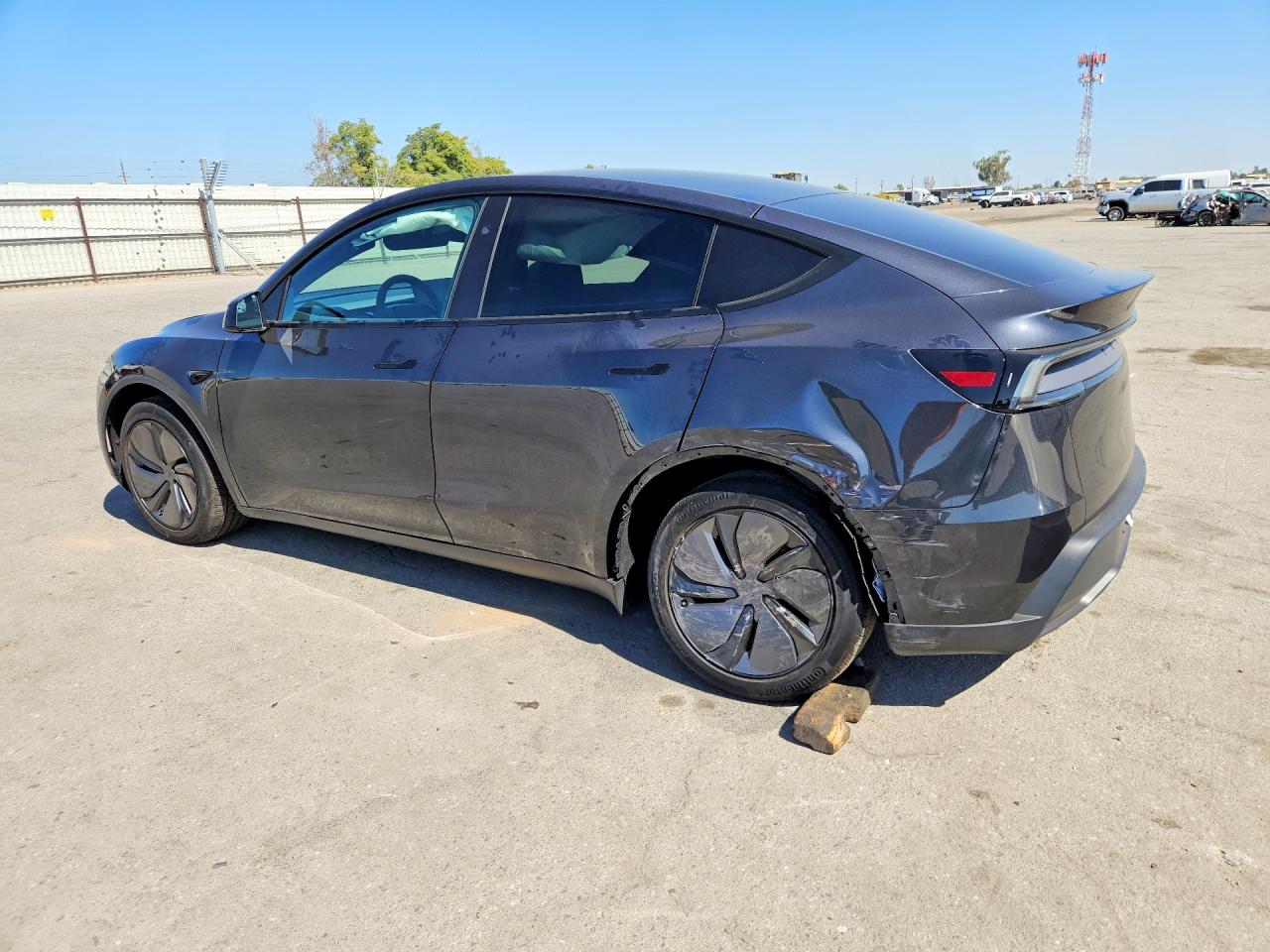 2026 Tesla Model Y Black vin: 7SAYGDED1TF660140