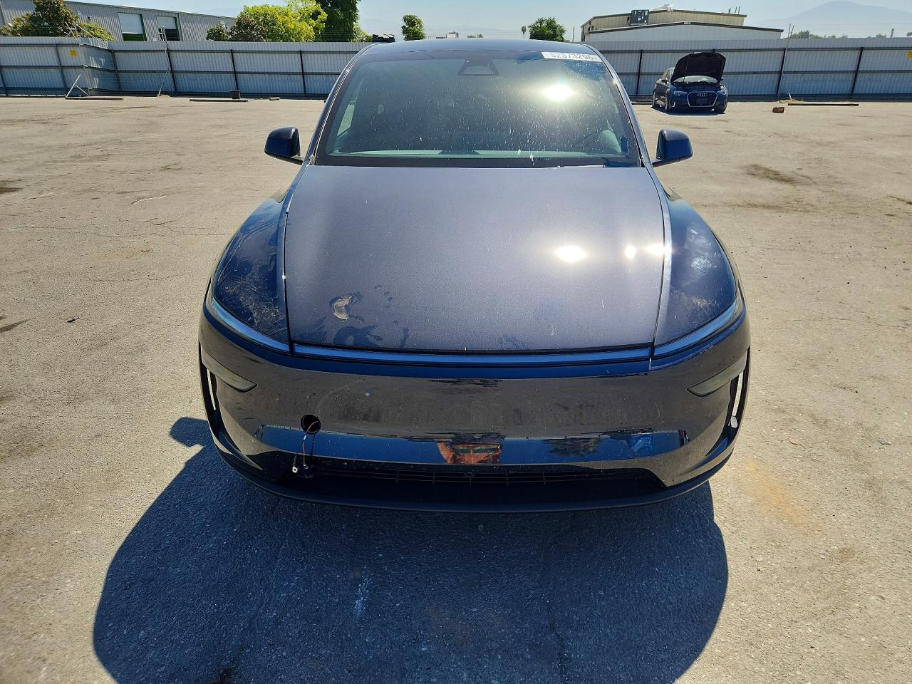 2026 Tesla Model Y Black vin: 7SAYGDED1TF660140